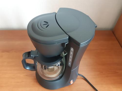 a coffee maker is sitting on a table at Bună Ziua apartment Tonitza Nic. in Cluj-Napoca