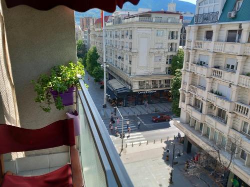 a view of a city street from a balcony at Adriana's Apartment in Skopje