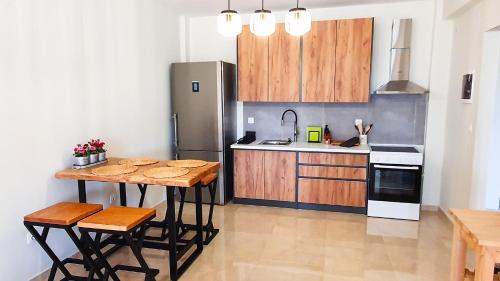 Cucina o angolo cottura di Anemos Deluxe Poseidi Apartments