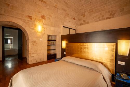 Ένα ή περισσότερα κρεβάτια σε δωμάτιο στο San Tommaso Hotel