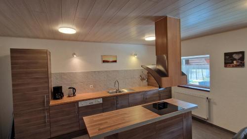 a kitchen with a sink and a counter at AMW Ferienwohnungen in Legau