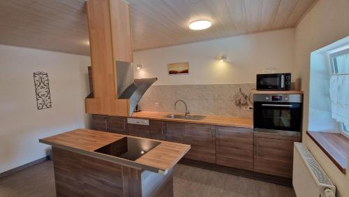 a kitchen with a sink and a stove at AMW Ferienwohnungen in Legau