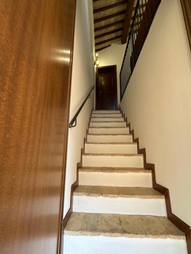 a staircase leading up to a door in a building at Il Cantico Suite in Assisi