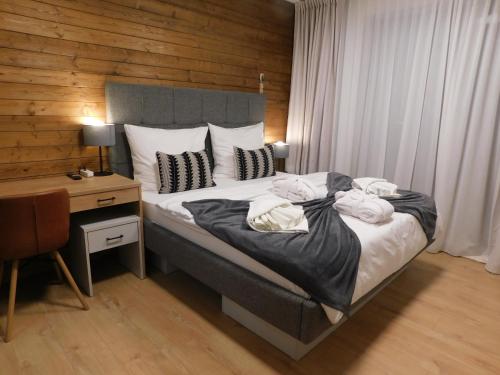Postel nebo postele na pokoji v ubytování Wellness Rezort Tatranská Štrba
