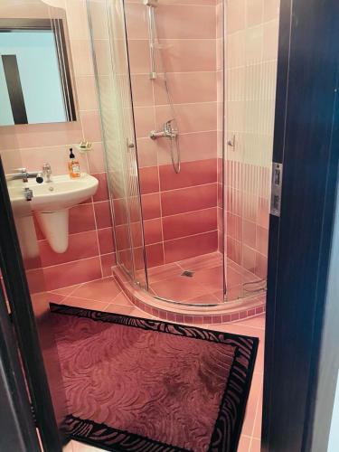 a bathroom with a shower and a sink at private apartments in Apolon in Ravda