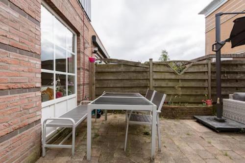 a table and two chairs on a patio at Sky Villa in Bergschenhoek