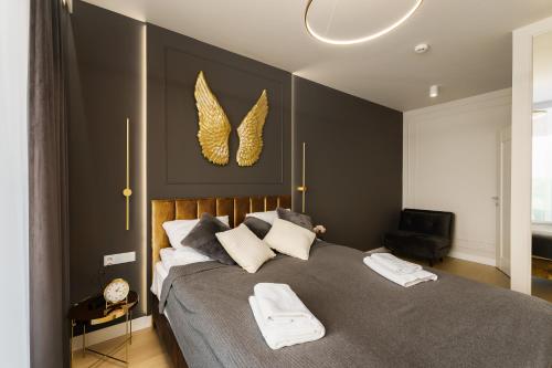 Ένα ή περισσότερα κρεβάτια σε δωμάτιο στο Apartament z basenem Polanki Aqua D306