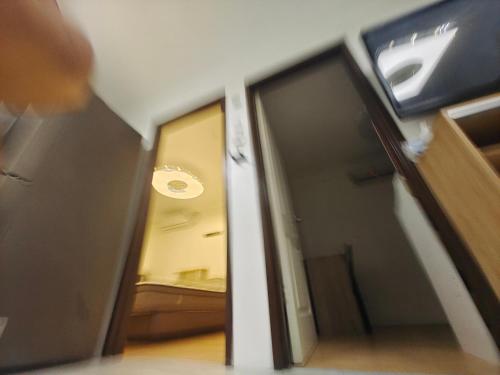 an open door to a room with a bedroom at Best inn one oasis two bed room B2 524 in Carreta