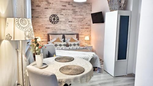 Ένα ή περισσότερα κρεβάτια σε δωμάτιο στο Sophia Studio