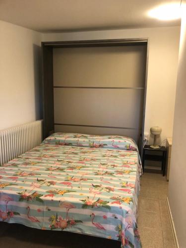 a bedroom with a bed with a large headboard at Barbara in Santa Maria di Scacciano
