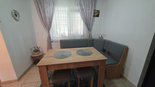 a table and chairs in a room with a dining room at Cazare la fermă in Galeşu