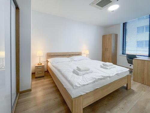 Ένα ή περισσότερα κρεβάτια σε δωμάτιο στο Metropolitan Star Apart Hotel