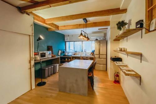 a kitchen with a large island in a room at Private House near Take-no beach 一棟貸し 竹野浜 城崎すぐ in Toyooka