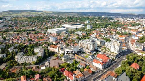 an aerial view of a city with buildings and a stadium at Ateneea Luxury Rooms in Cluj-Napoca
