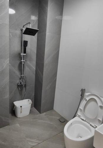 a bathroom with a toilet and a shower at Sky Haven Staycation in Rizal