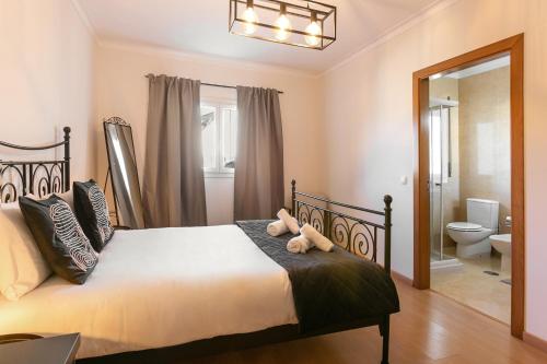 a bedroom with a bed with two teddy bears on it at Ferrel Apartment in Ferrel