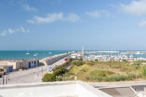 a view of a harbor from the roof of a building at Le Dune Luxury Rooms in Vieste