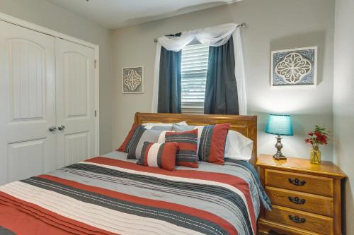 a bedroom with a bed and a dresser and a window at Cozy Norman Home 4 Mi to Oklahoma University! in Norman