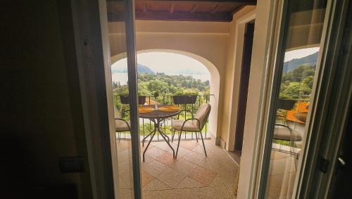 a view of a balcony with a table and chairs at Villa Antica Colonia SPA & Wellness in Pettenasco