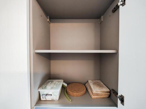 a walk in closet with bread and other items at Brissaghino al Lago 5* in Brissago