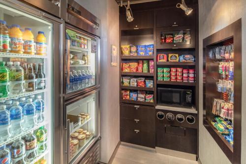 a refrigerator filled with lots of food and drinks at Courtyard by Marriott Boston Brookline in Brookline