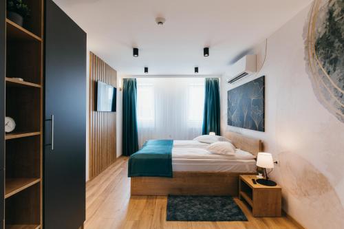 A bed or beds in a room at NOZON Apartments & Wellness