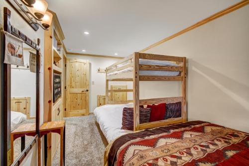 a bedroom with a bunk bed in a room at Two Bedroom Condo with Parking, Pool, Hot Tub - Steps to Main Street in Breckenridge