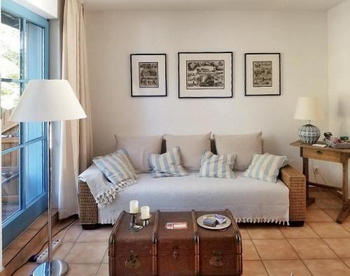 a living room with a couch and a table at Blinkfüer am Kap Arkona in Putgarten