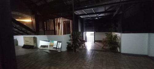an empty room with plants in a building at Eka Homes 3BHDK Villa in Trivandrum