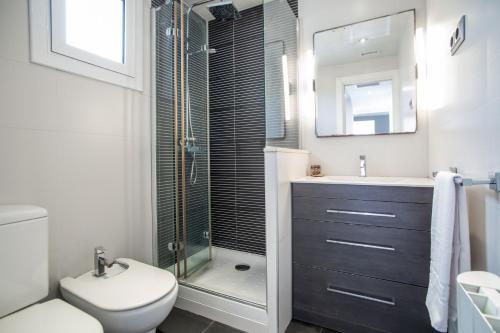 a bathroom with a shower and a toilet and a sink at S2SEP498 - Great apartment with private terrace in Barcelona