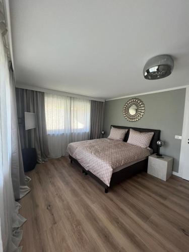 a bedroom with a bed and a wooden floor at Bergerwachen in Berchtesgaden