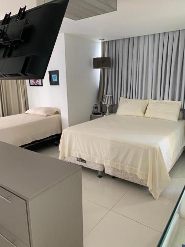 Ένα ή περισσότερα κρεβάτια σε δωμάτιο στο Casa Grande em GRAVATÁ RS3-27