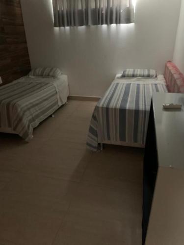 Ένα ή περισσότερα κρεβάτια σε δωμάτιο στο Casa Grande em GRAVATÁ RS3-27