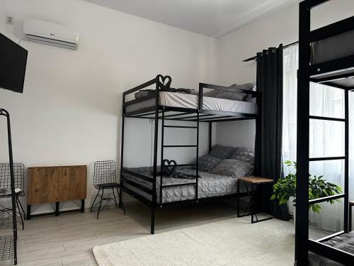 a bedroom with two bunk beds in a room at Zeus in Cluj-Napoca