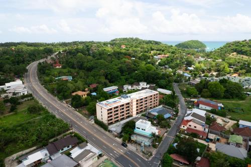 an aerial view of a city with a highway at Студия вид на бассейн Раваи 418 by IBG Property in Phuket Town