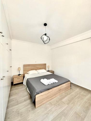 Ένα ή περισσότερα κρεβάτια σε δωμάτιο στο Luxury 2 bedroom apartment in Kavouri near the beach