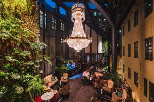 an overhead view of a restaurant with a chandelier at Hotel Kungsträdgården in Stockholm