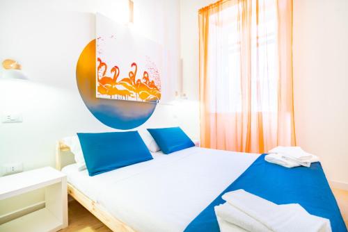 Postel nebo postele na pokoji v ubytování Sunscape Rooms Cagliari City Center