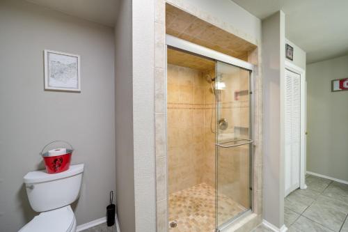 a bathroom with a shower with a toilet in it at Spacious Arkansas Abode with Balcony and Fire Pit! in Fort Smith