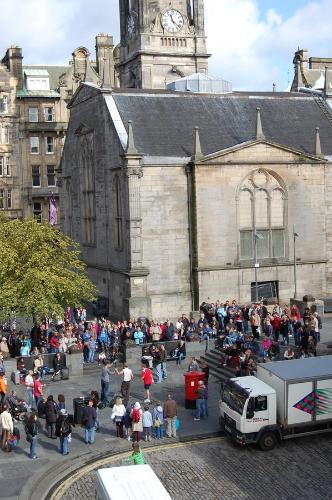 a crowd of people standing outside of a building with a clock tower at Royal Mile Blair in Edinburgh