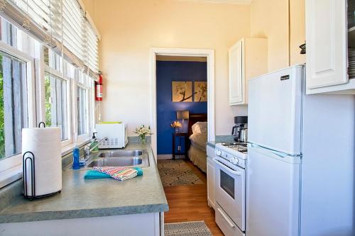 a kitchen with a white refrigerator and a sink at Clarkdale Lodge 208 in Clarkdale