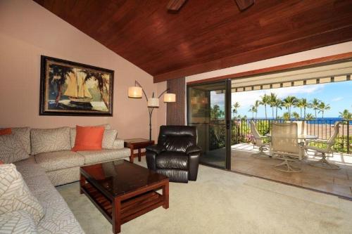 a living room with a couch and a table at WAILEA ELUA, #1508 condo in Wailea