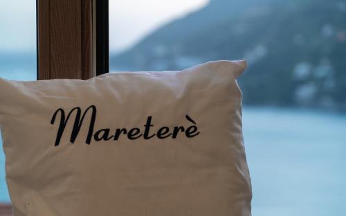 a pillow with the word marauder written on it at Mareterè in Vietri sul Mare
