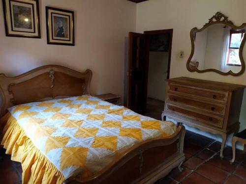 Ένα ή περισσότερα κρεβάτια σε δωμάτιο στο Sítio Casarão