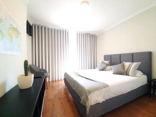 Кровать или кровати в номере Sonetos - Guest House