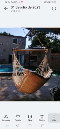 a picture of a hammock in front of a house at Quincho la querencia in Posadas
