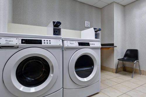 a washing machine in a room with a chair at Hampton Inn & Suites Clearwater St Petersburg Ulmerton Road FL in Clearwater