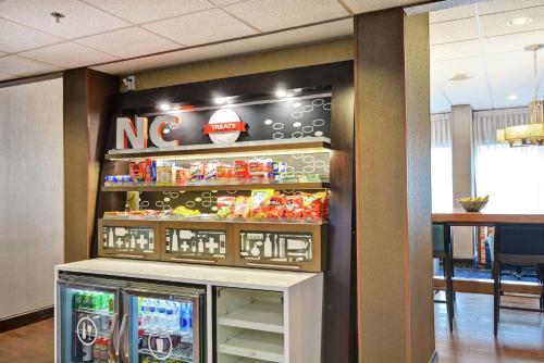 a no smoking sign is above a snack refrigerator at Hampton Inn Charlotte-Gastonia in Gastonia