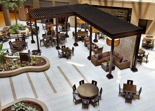 an overhead view of a restaurant with tables and chairs at Embassy Suites by Hilton Crystal City National Airport in Arlington