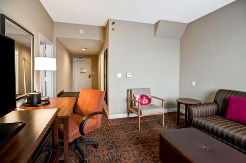 a living room with a couch and a table at Hampton Inn Baltimore/Glen Burnie in Glen Burnie